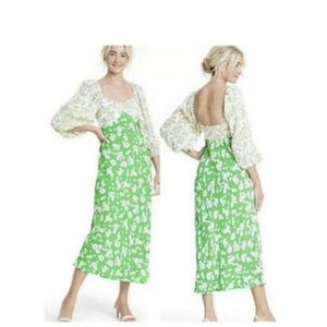 Green daisy dress with puffer sleeves.